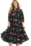 Woman wearing a black dress with floral patterns on a white background