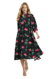 Woman wearing a black dress with floral pattern on a white background, featuring Umgee Exclusive branding.