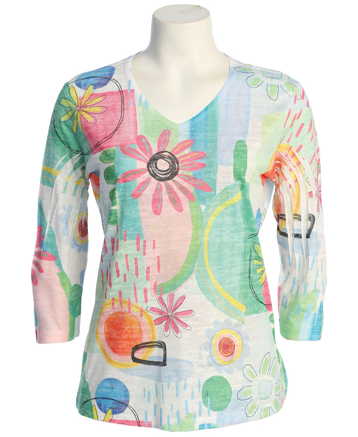 Colorful floral and abstract patterned shirt on a mannequin against a white background