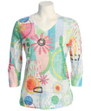 Colorful floral and abstract patterned shirt on a mannequin against a white background