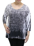 Black and white patterned top worn by a person on a white background