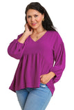 Woman wearing a purple blouse with text indicating 'Plus Size' and 'Purple'.