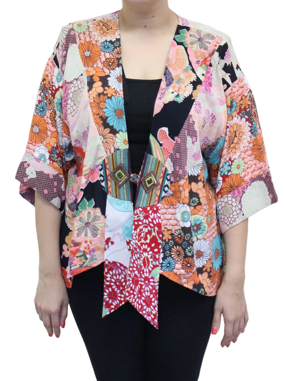 Colorful floral-patterned kimono-style jacket on a plain background