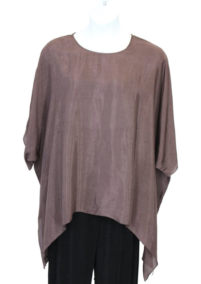 Brown oversized shirt with black pants on a white background