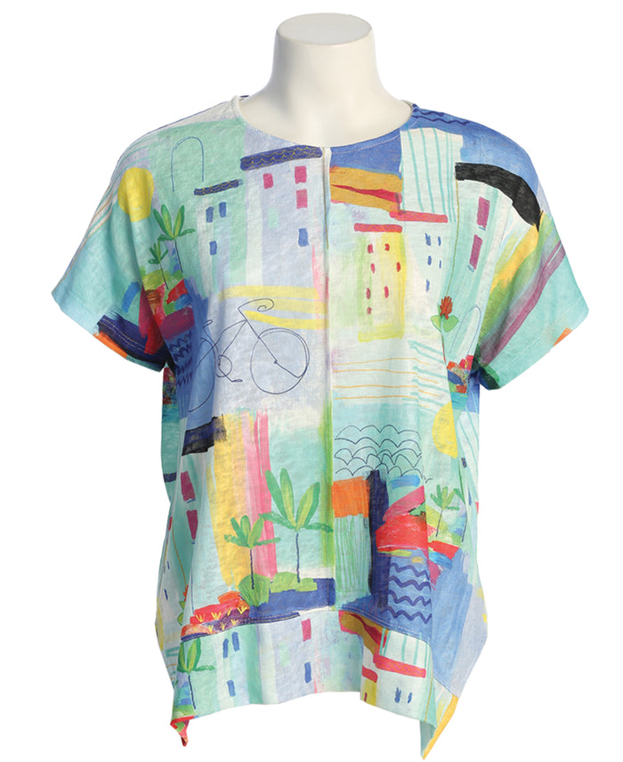 Colorful abstract patterned shirt on a mannequin against a white background