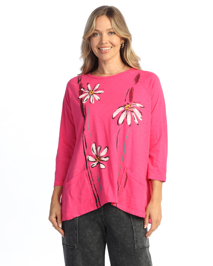 Woman wearing a pink floral top on a white background
