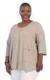 Woman wearing a beige cardigan with a white background